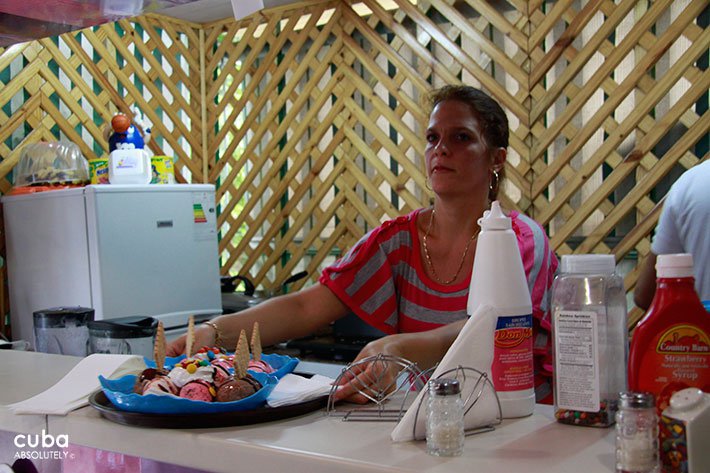 lady serving a dish of icecream © Cuba Absolutely, 2014