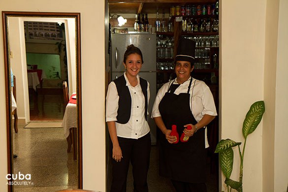 2 waiters wearing their balck and white uniforms © Cuba Absolutely, 2014