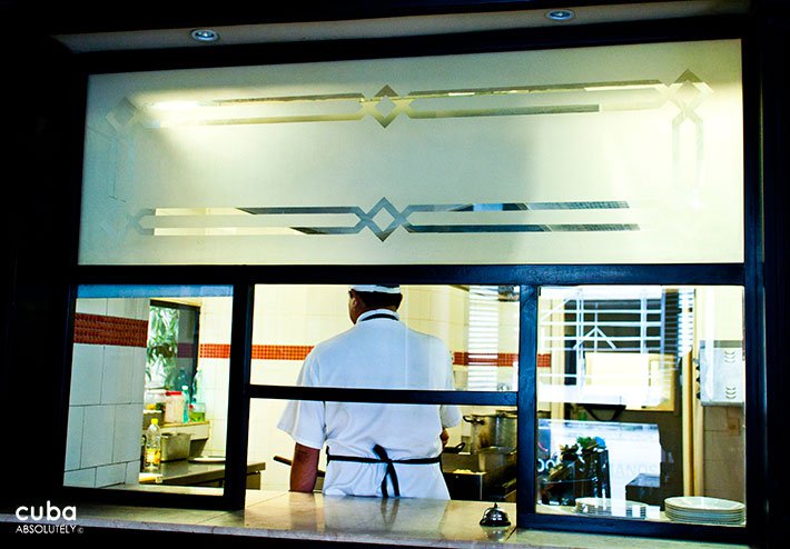 chef in the kitchen making a dish © Cuba Absolutely, 2014