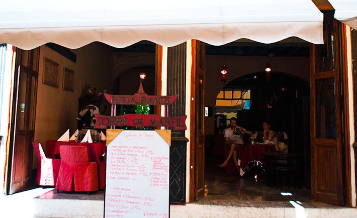 Front of Torre de marfil restaurant in Old Havana, menu in door © Cuba Absolutely, 2014