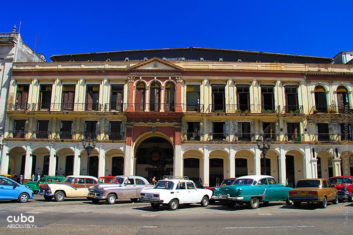 Sport center Kid Chocolate in Old Havana with cars parking in front  © Cuba Absolutely, 2014