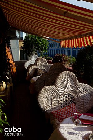 white chairs at a restaurant © Cuba Absolutely, 2014