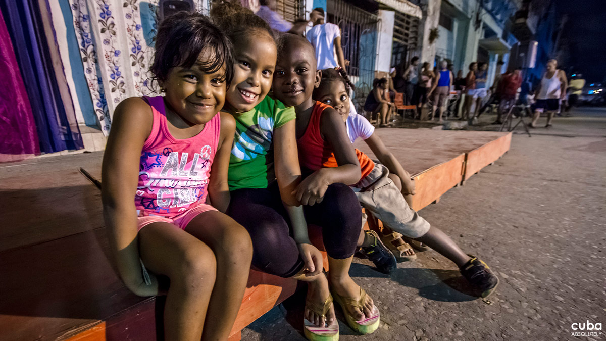 Meanwhile, the little ones run around, happy to be able to stay up late. Havana, Cuba